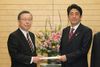 Photograph of Prime Minister Abe receiving a courtesy call from the Governor of Fukushima Prefecture, Mr. Yuhei Sato 1