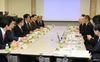 Photograph of Prime Minister Abe having talks with President Noyori, Professor Yamanaka, and others