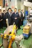 Photograph of the Prime Minister observing the factory of thin leaf springs