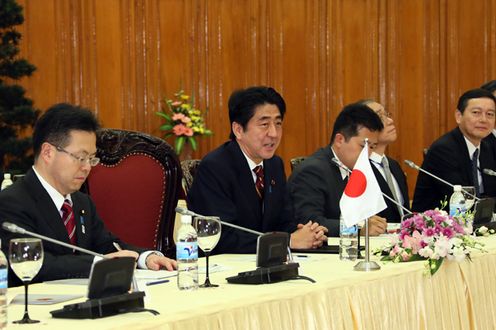 Photograph of the Prime Minister delivering an address at the Japan-Viet Nam Summit Meeting
