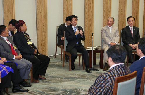 Photograph of Prime Minister Abe receiving a courtesy call from Special Envoy of the Government of Japan for National Reconciliation in Myanmar Yohei Sasakawa and a delegation of minority groups from Myanmar 1