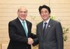 Photograph of Prime Minister Abe shaking hands with the OECD Secretary-General, Mr. Angel Gurría