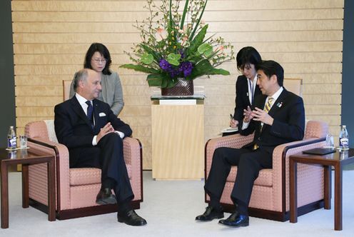 Photograph of Prime Minister Abe receiving a courtesy call from Minister of Foreign Affairs of the French Republic Mr. Laurent Fabius