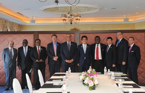 Photograph of the Prime Minister receiving a courtesy call from a group of leaders of major international organizations and other officials