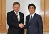 Photograph of Prime Minister Abe shaking hands with the Prime Minister of the Slovak Republic, Mr. Robert Fico