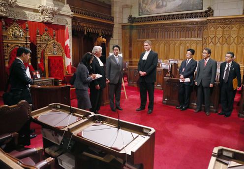Photograph of Prime Minister Abe being guided around the Senate chamber by Senate Speaker Kinsella