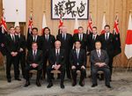 Photograph of the Prime Minister attending a commemorative photograph session with the New Zealand national rugby team, the 