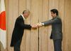 Photograph of Prime Minister Abe presenting Mr. Masao Kuniyoshi with the Prime Minister's certificate of appreciation