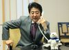 Photograph of Prime Minister Abe making the congratulatory telephone call to Olympic team member Mr. Yuzuru Hanyu (1)