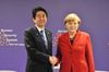 Photograph of Prime Minister Abe shaking hands with H.E. Dr. Angela Merkel, Federal Chancellor of the Federal Republic of Germany