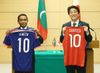 Photograph of the leaders exchanging the uniforms of the national football teams of their respective countries (2)