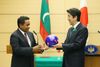 Photograph of the Prime Minister presenting a football (1)