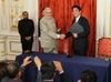 Photograph of the leaders exchanging documents at the Signing Ceremony for the Japan-India Joint Statement