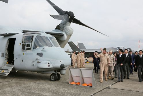Photograph of the Prime Minister observing Osprey and other aircraft during the static display