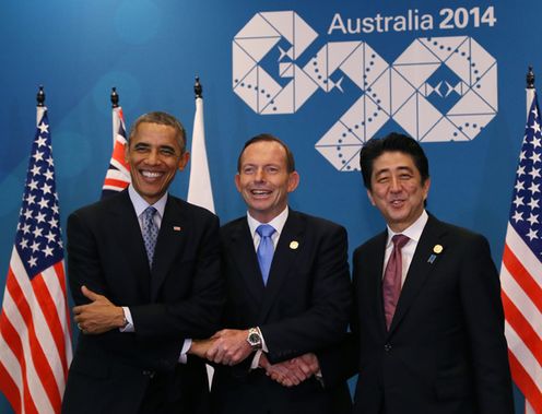 Photograph of Prime Minister Abe shaking hands with the President of the United States and Prime Minister of Australia