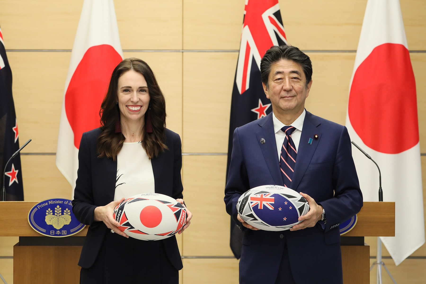 Photograph of the leaders exchanging rugby balls (2)