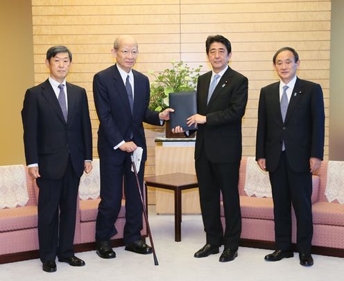 Photograph of the Prime Minister being presented with the report (1)
