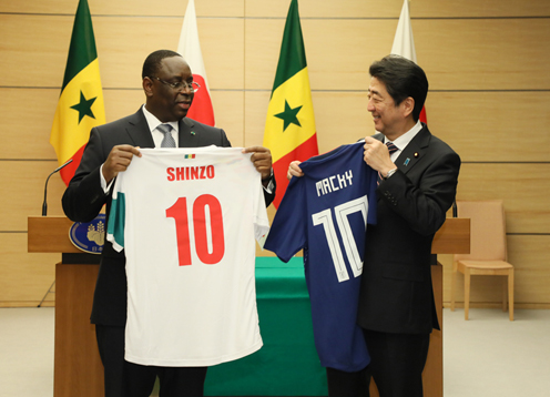 Photograph of the leaders exchanging uniforms (1)