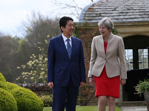 Photograph of the leaders taking a walk in a garden (2)