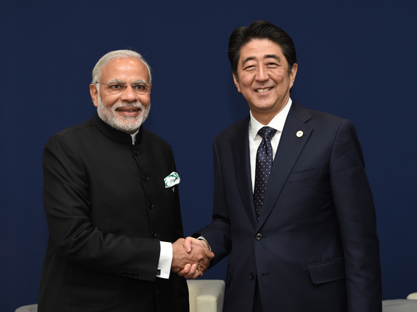 Photograph of the Prime Minister shaking hands with the Prime Minister of India