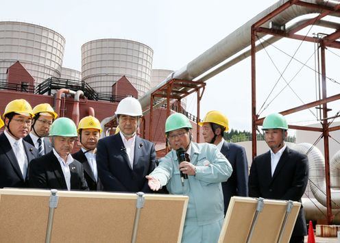 Photograph of the Prime Minister visiting a geothermal power plant