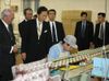 Photograph of the Prime Minister observing a manufacturing line in the factory (1)
