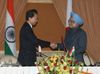 Photograph of Prime Minister Hatoyama shaking hands with Prime Minister Manmohan Singh of India