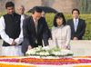 Photograph of Prime Minister and Mrs. Hatoyama offering a wreath in Raj Ghat