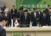 Photograph of the Prime Minister offering a silent prayer at the start of the Japan-China-ROK Trilateral Summit Meeting