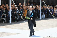 Photograph of the Prime Minister offering a flower