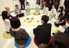 Photograph of the Prime Minister exchanging views with users, nursery staff, and others at an in-house nursery school