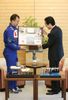 Photograph of the Prime Minister being presented with a photograph of Mount Fuji taken from space