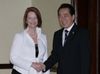 Photograph of Prime Minister Kan shaking hands with Prime Minister Gillard of Australia