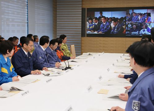 Photograph of the Prime Minister conducting a video conference drill