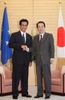 Photograph of Prime Minister Kan shaking hands with President Mori