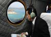 Photograph of the Prime Minister observing the coast off Henoko from the air