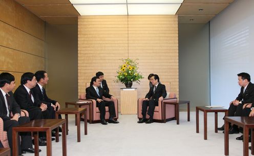 Photograph of Prime Minister Kan meeting with Permanent Member of the Secretariat of the Communist Party of Viet Nam Central Committee Truong Tan Sang 2