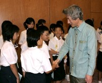 Photograph of Prime Minister shaking hands with the junior reporters