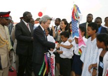 Photograph of Prime Minister receiving a welcome from children
