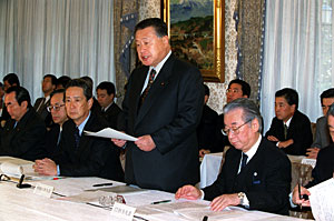 Prime Minister Mori receives a copy of the 