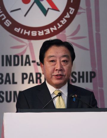 Photograph of the Prime Minister delivering an address at an event related to the India-Japan Global Partnership Summit 2013 2
