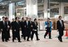 Photograph of the Prime Minister observing Naha Airport's new cargo terminal