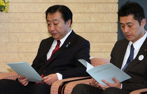 Photograph of the Prime Minister reading a letter of request
