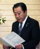 Photograph of the Prime Minister reading a letter of request from the town and village assemblies in Futaba County, Fukushima Prefecture