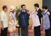 Photograph of the Prime Minister receiving <i>kariyushi</i> shirts