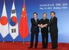 Photograph of Prime Minister Noda shaking hands with Premier Wen of China and President Lee of the ROK before the Japan-China-ROK Trilateral Summit Meeting 2