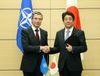 Photograph of Prime Minister Abe and the NATO Secretary General, Mr. Anders Fogh Rasmussen, shaking hands following the signing ceremony