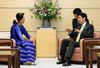 Photograph of Prime Minister Abe receiving a courtesy call from Chairperson of the National League for Democracy of the Republic of the Union of Myanmar Ms. Aung San Suu Kyi