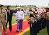Photograph of the Prime Minister receiving a welcome from children during the welcome ceremony