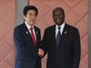 Photograph of Prime Minister Abe shaking hands with President Alassane Ouattara of the Republic of Cote d'Ivoire
